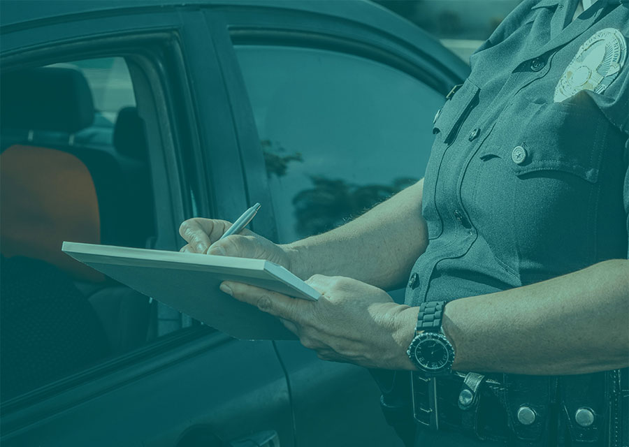 Officer writing a ticket or warning