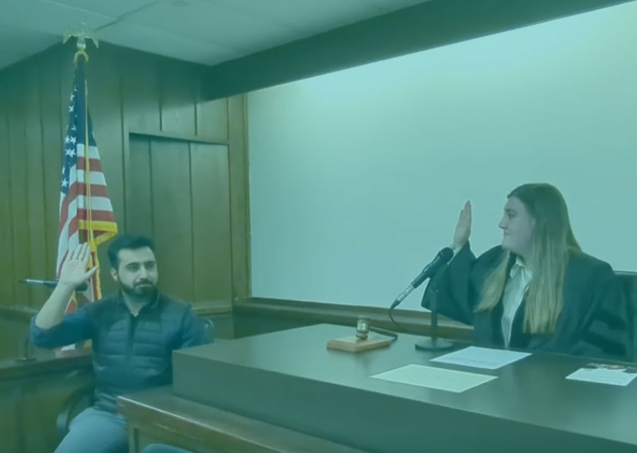 Woman sitting in the judge and student in chair